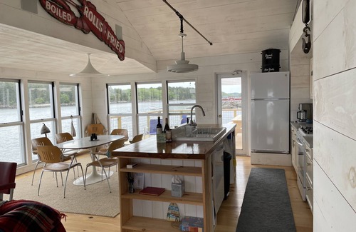Georgetown Cottage | Waterfront, west facing, modernized fisherman’s cottage perched on the water.