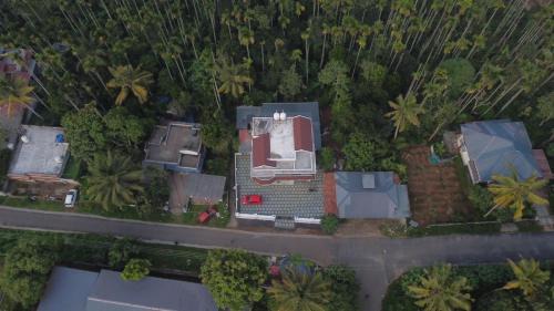 Sulthan Bathery House | Wayanadan Huts Homestay