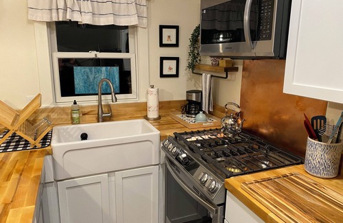 Malletts Bay Cottage | Welcome to 54 West Lake Shore Drive, a charming, single-floor home near the peaceful shores of Lake Champlain. This 1,200-square-foot residence offers 2 bedrooms (1 King, 1 Queen), 1.5 bathrooms with a shower and soaker tub. The thoughtfully designed
