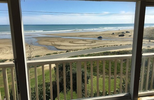 Glinks Gully House | West Coast Heaven. A rustic, cosy New Zealand bach.