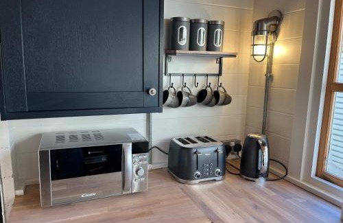 Chwilog Cabin | White River Retreats luxury lodges with Private Wood Fired Hot Tub
