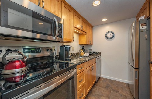 Thayerville Condo | Will O' The Wisp 104B: Lakefront One Bedroom Condo with 2 Fireplaces & Flat Scre