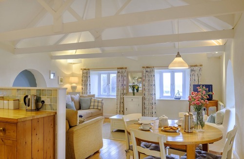 Portholland Cottage | Wonderful reverse level conversion located on the sea front in picturesque rural hamlet on the South