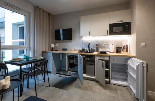 Srodmiescie Apartment | Work & Rest Apartment by Fengshui4u, cowroking, siłownia, nowy budynek, dostęp na kod