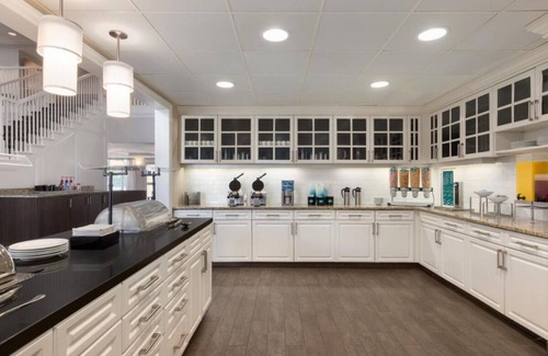 Feather Sound Hotel | Your Home Away From Home! Free Breakfast, Outdoor Pool, Full Kitchen!