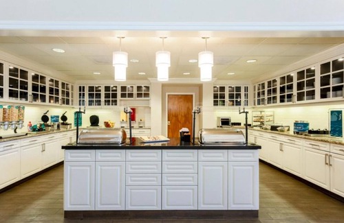 Feather Sound Hotel | Your Home Away From Home! Free Breakfast, Outdoor Pool, Full Kitchen!