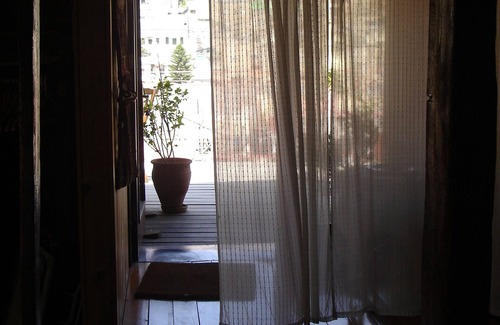 Nazareth Apartment | Zimmer Alreda one open space, wooden floor 120 years old QOTRAN wood columns