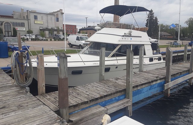 30' CARVER BOAT DOCKED AT MENOMINEE MARINA IN HISTORIC DOWNTOWN MENOMINE MI.