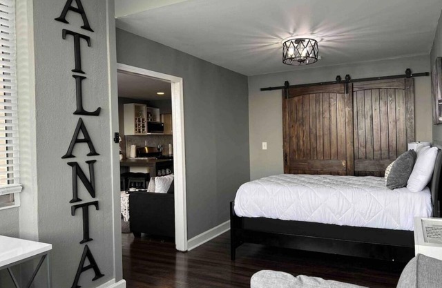 Admire the penthouse view of Atlanta’s skyline in this city chic condo in Midtwn