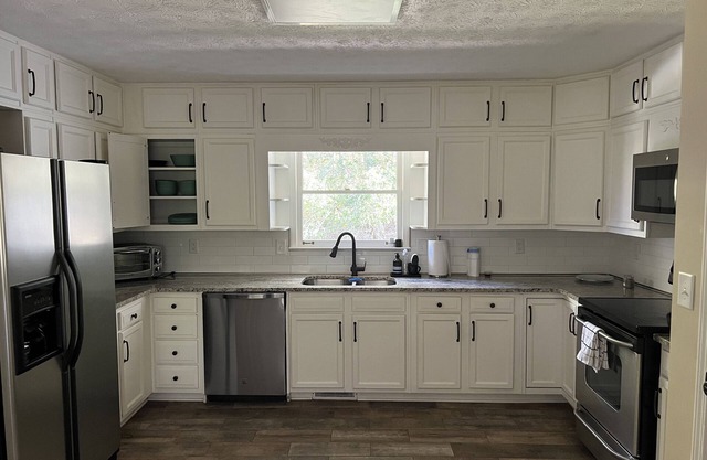 ALL DECKED OUT Secluded Spacious home with POOL Close to the city !
