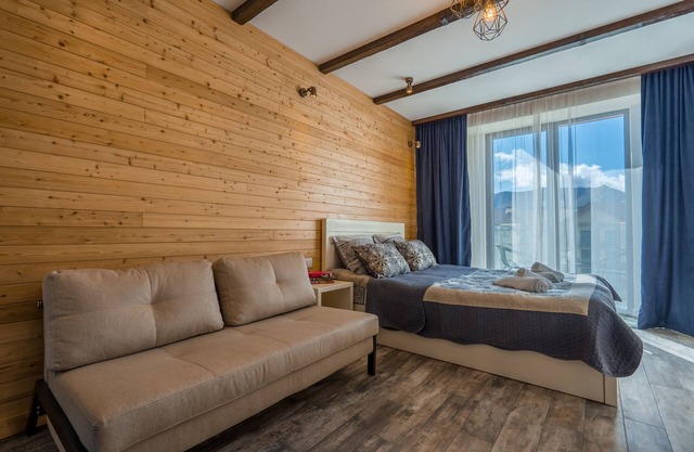 Apartment decorated with a lots of wood, with breathtaking view on mountain