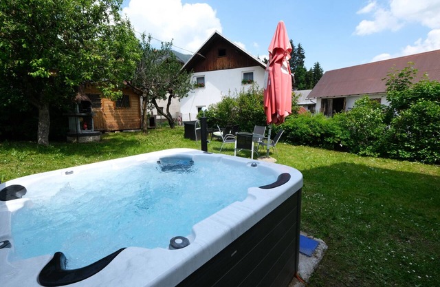 Apartment Planica 2 with a garden & a hot tub