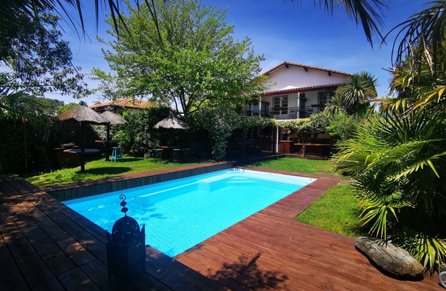 "Beach House" in SW France, tropical garden, pool and room for 27 people.