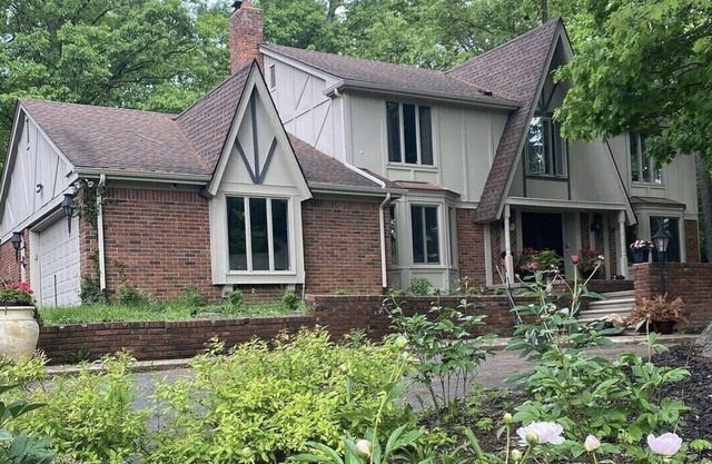 Beautiful English Farmhouse Tudor, situated on a lush hillside acre.