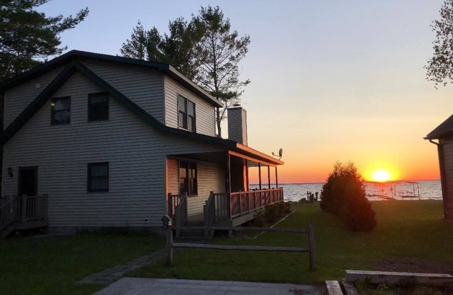 Black Lake sunset waterfront home 78' private sandy beach on prestine Black Lake
