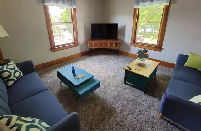 Breathtaking house steps from the river with incredible 1890s woodwork & floors