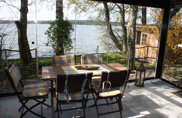 Bungalow directly on the lake with conservatory, very private - Ferienhof Löschebrand