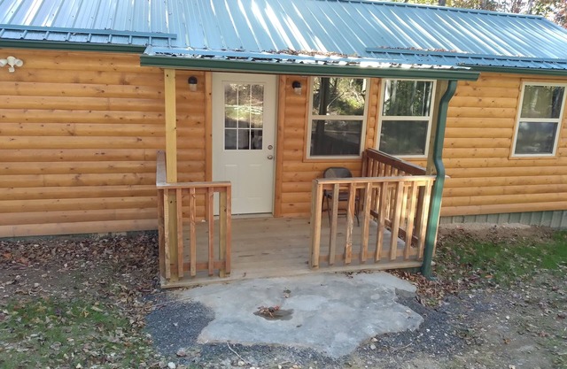 Cabin with a tree house on a working buffalo farm near the Buffalo River.