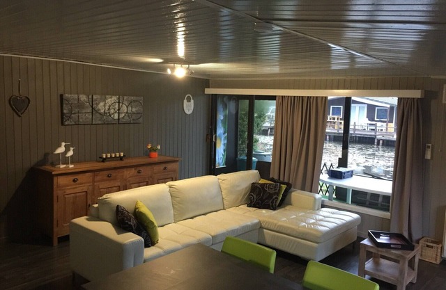 Chalet in park with a fishing pond