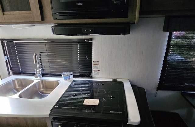 Charming mobile home for camping at your favorite locations with AC . Sleeps 6 .