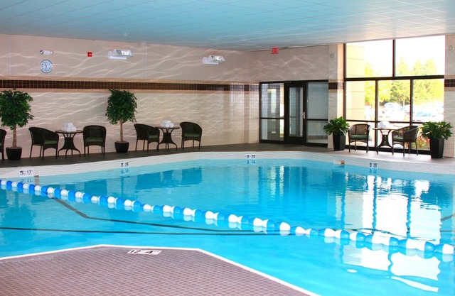 Comfortable Suite Near Hancock International Airport | Free Breakfast + Fitness Center