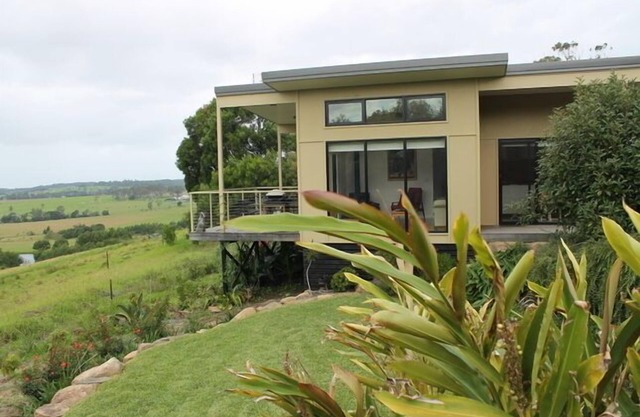 Contemporary stylish luxury retreat featuring passive solar design + wood heater