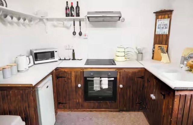 Cosy Seaside Apartment in old stone cottage, steps from the beach.