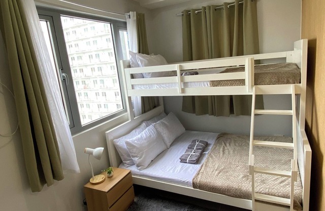 Cozy 1-bedroom condo with AC, WiFi in charming Quezon City