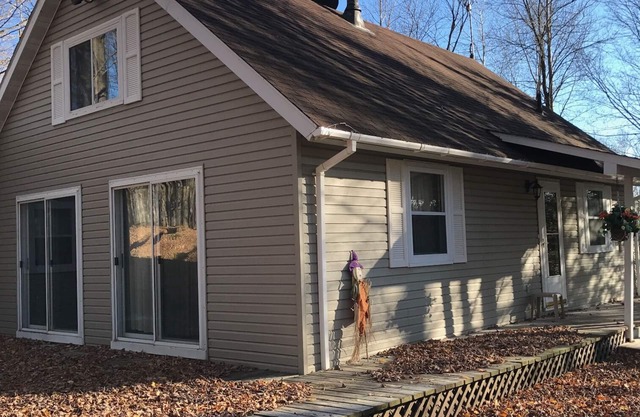 Cozy vacation home nestled in a quiet wooded area. Near town but private