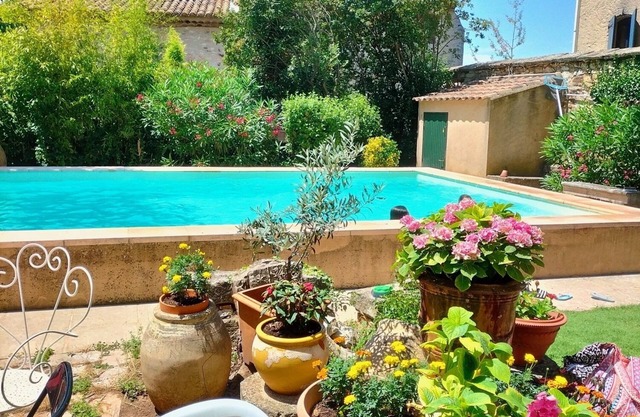 Family house with swimming pool in a charming village