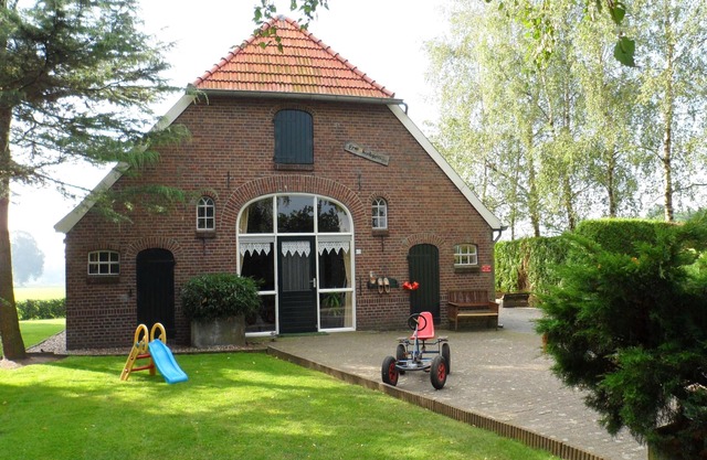 Farmhouse with large garden and play equipment