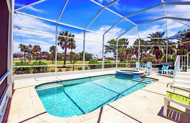 Golf course pool home on 12th hole of the Sanibel Island Golf Club - Isle Awhile