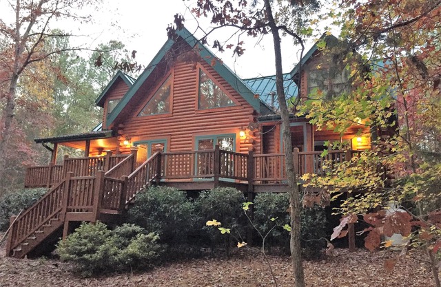 Gorgeous lakefront log home on secluded cove with private beach and boat dock