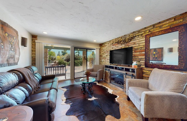 Ground-floor condo with on-site pool, grills, patio, & central AC