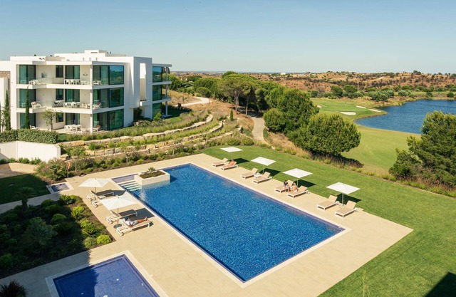 Heated pool, lush gardens, and air conditioning at Monte Rei.