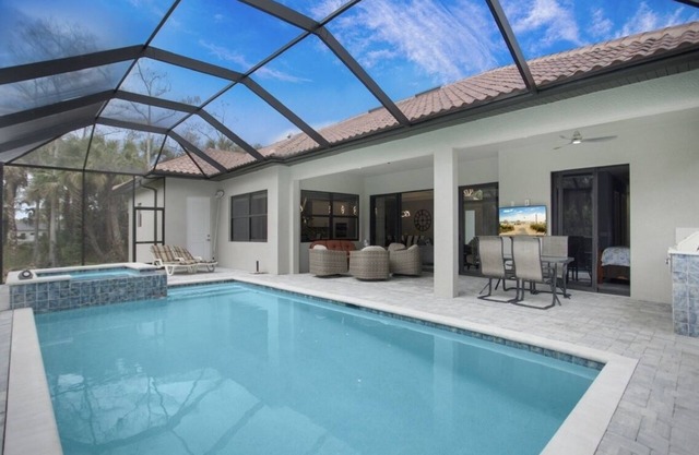 Heated pool, hot tub, outdoor kitchen, privacy, all bedrooms w tv & ceiling fans