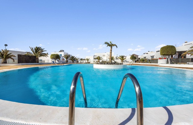 Holiday home at the harbour of Puerto Calero with roof terrace, garden and pool