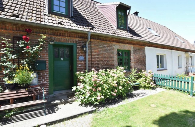 Holiday home with fireplace, terrace, and garden