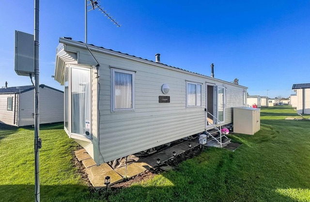 Homely 6 berth caravan for hire by the beach at California Cliffs ref 50006F