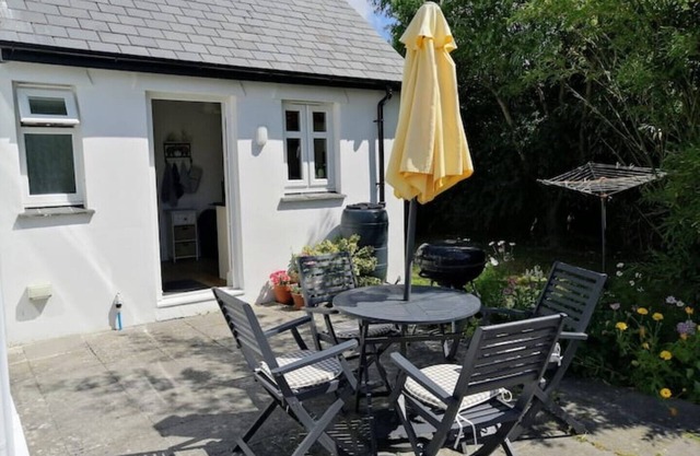 Honeysuckle Cottage with optional hot tub and shared EV charger.