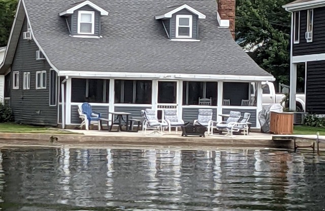 Lake front cottage recently remodeled w/private dock and optional pontoon boat.