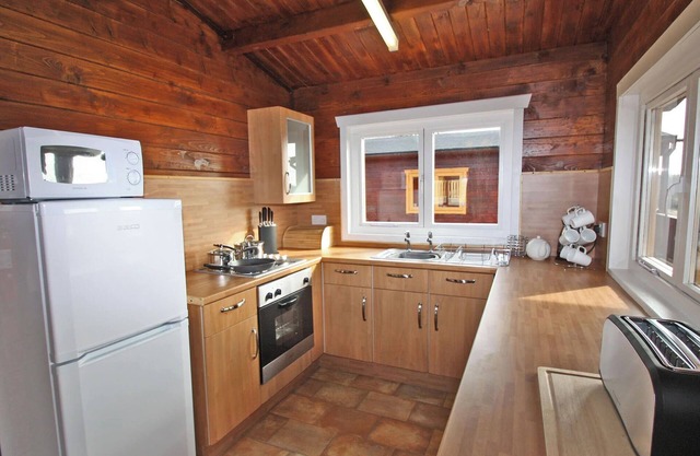 Lake side log cabin peacefully situated and each enjoying fabulous lake views.