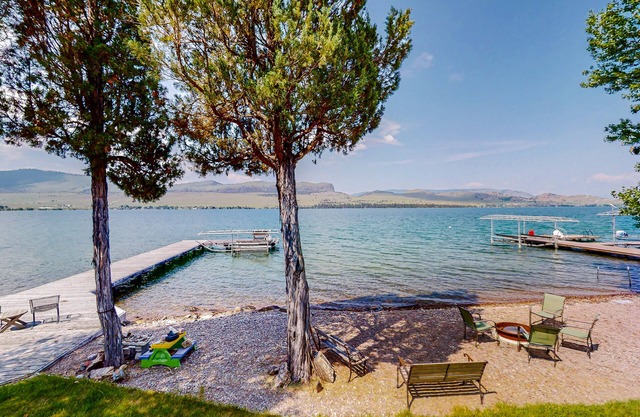Lakefront home with private beach, dock, firepit, & grill - dazzling sunset view