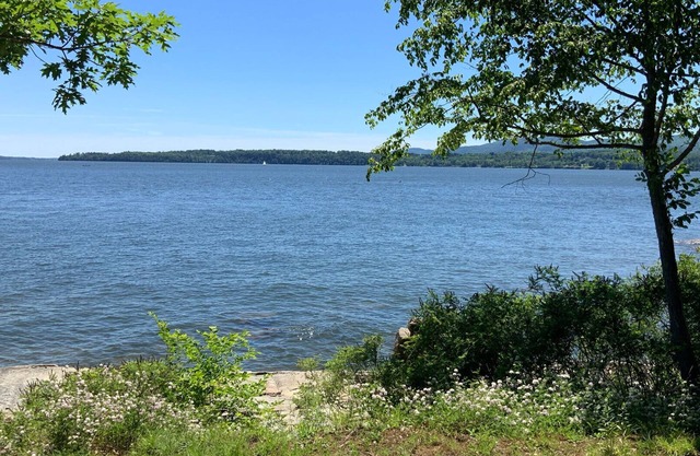 Lakefront home with tennis court and dock on gorgeous Lake Champlain
