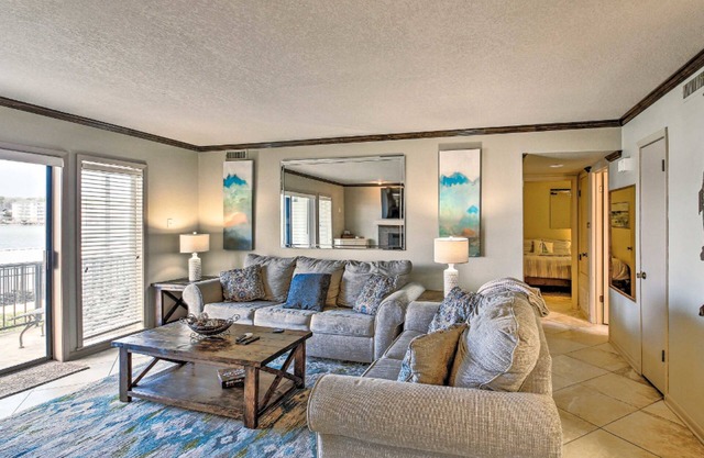 Lakefront resort condo with pool, pickleball, balcony, & AC