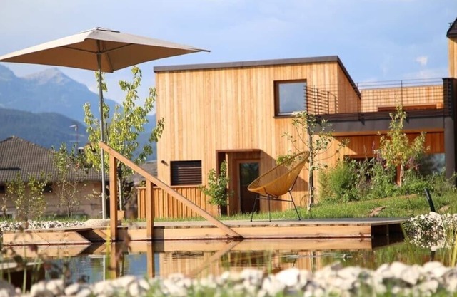 Landhaus Silene: new + modern wooden house with large natural garden and swimming pond