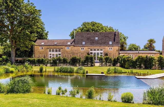 Luxury barn conversion on rural Cotswolds farm with swimming pond