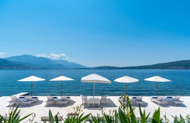 Luxury beachfront villa with private beach and relaxation area