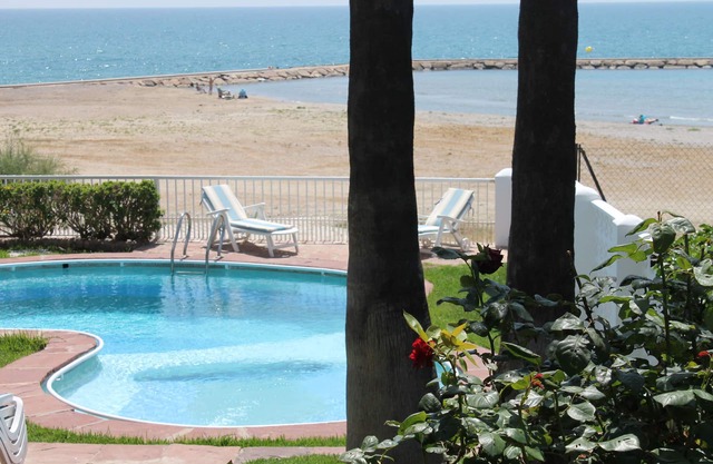 Luxury beachside villa with private pool, terrace and sea views.