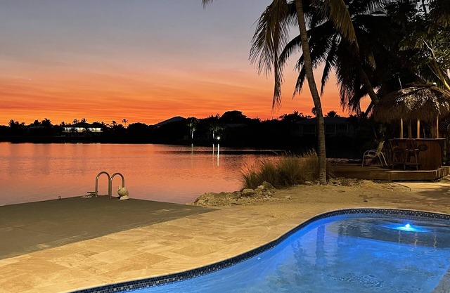 Luxury Waterfront Home with Gorgeous Pool, Tiki Bar and Sunsets